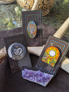 The Brady Tarot Enamel pins: the Hermit, the Empress, and the Sun